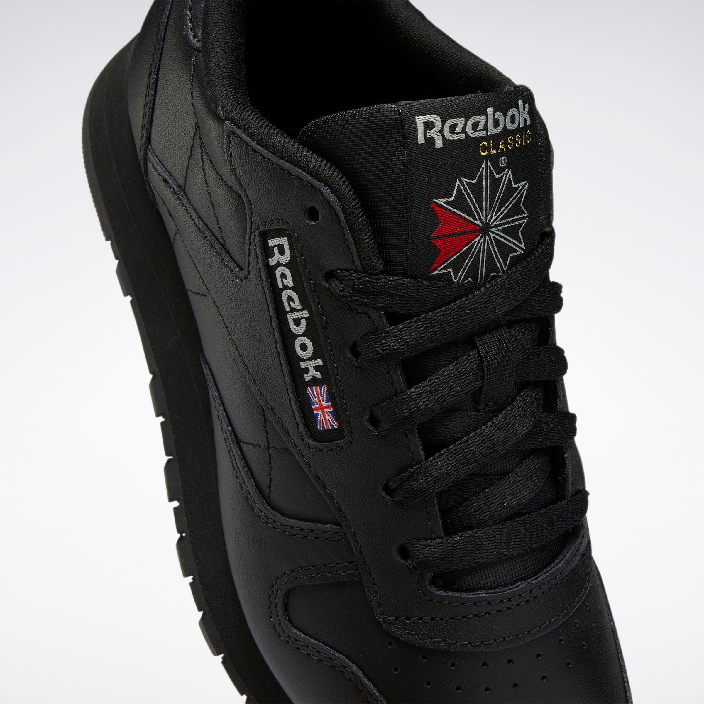 Reebok classic black on sale sneakers