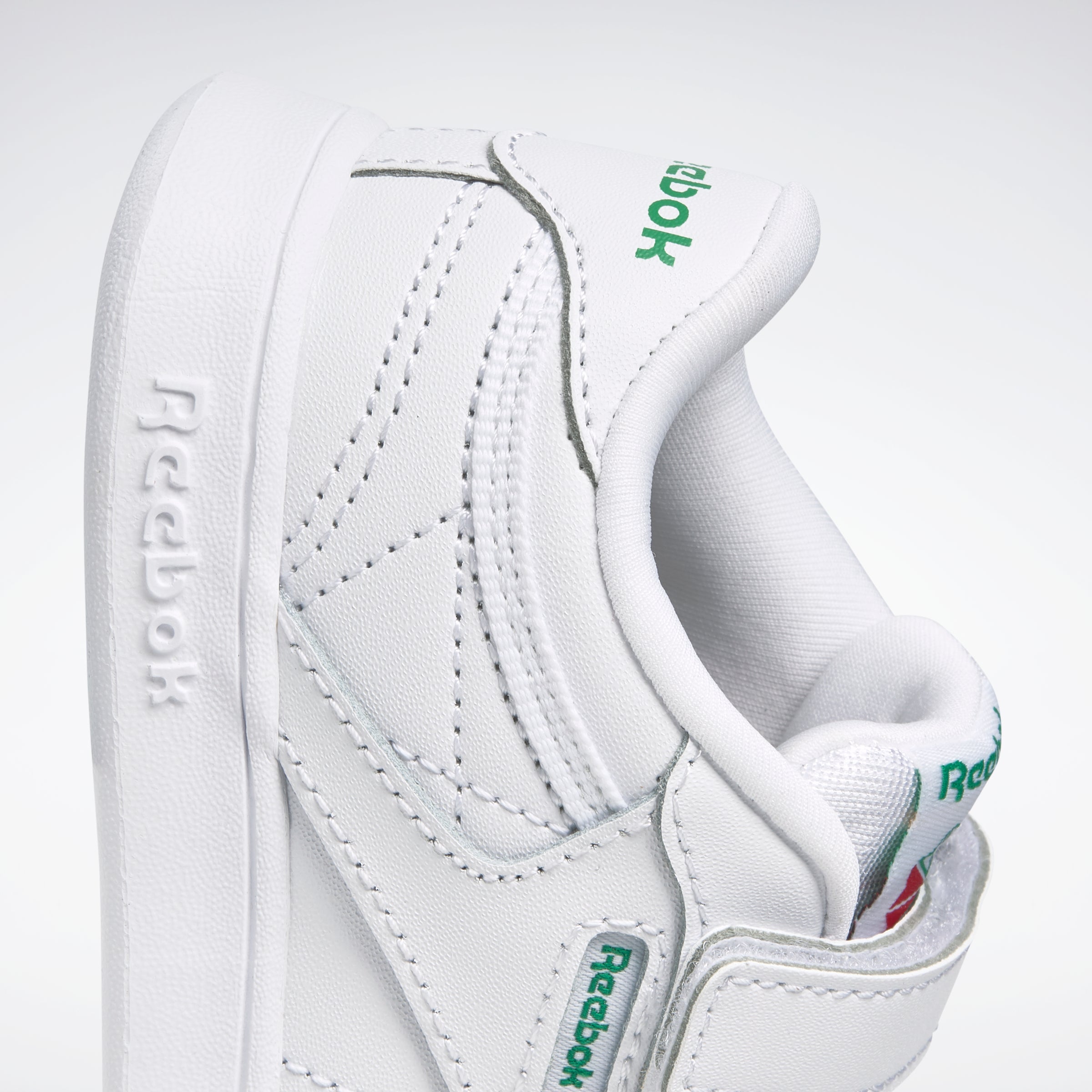 Green on sale reebok sneakers